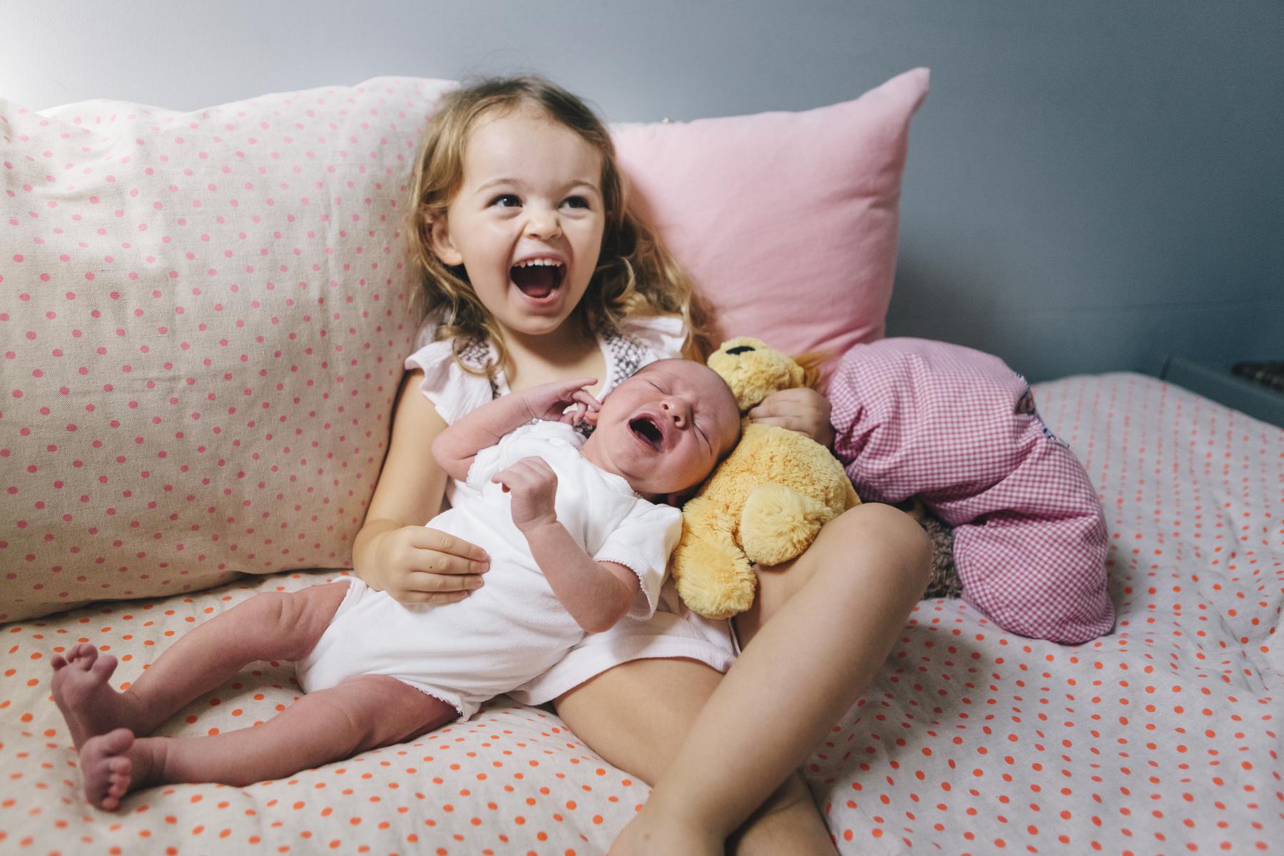 Girl with baby sister photo - © Lucy Leonardi